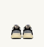 Vue arrière des Autry Hyperway UM07 noires, sneakers homme à semelle vintage beige, dispo boutique Versailles