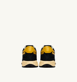 Sneakers Autry Reelwind noires et jaunes en mesh et daim, look rétro homme, dispo boutique Versailles