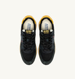 Sneakers Autry Reelwind noires et jaunes en mesh et daim, look rétro homme, dispo boutique Versailles