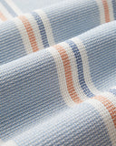 Chemise Radi Portuguese Flannel, tissu rayé bleu, blanc, orange, texture gaufrée.