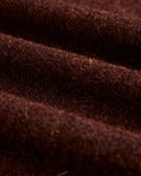 Gros plan sur la texture chinée bordeaux brun de la veste Aurelia Terroir