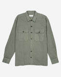 Chemise Décré Taza Vert Olive OLOW, coupe droite et élégante. Confectionnée en coton biologique, elle combine confort et style. Col classique et boutons sur le devant, parfait pour un look casual ou semi-formel.