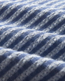 Détail des rayures tissées ton sur ton qui apportent profondeur et sophistication à la chemise. Une création authentique de Portuguese Flannel. Disponible chez SEE YOU à Versailles.