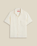 Chemise à manches courtes Salva White Portuguese Flannel – coupe droite, tissu blanc texturé en coton portugais de qualité. Élégance estivale et confort réunis. Disponible chez SEE YOU, concept store à Versailles.